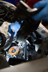 Mechanic fixing a car's engine 