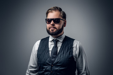 Fototapeta premium An elegant bearded business man in sunglasses.