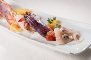 Chef made dish with shrimp, prawn and octopus