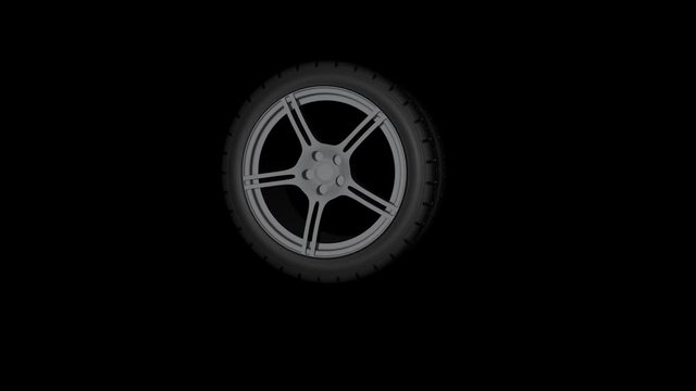 Reifen f&auml;llt auf den Boden und springt vor schwarzem Hintergrund