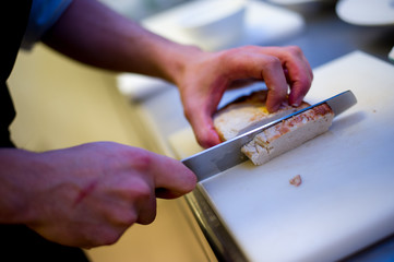 Chef chopping up a turkey breast