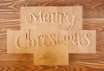 Wood inscription Merry Christmas on wood board. 