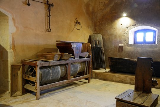 Old fashioned pressing equipment inside the Arkadi Monastery, Crete.