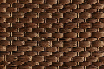 Bamboo woven brown mat handmade background. Wicker wood texture. Horisontal strips.