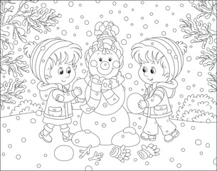 Children making a Christmas snowman