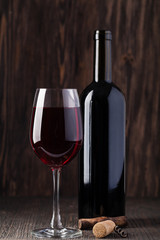 Bottle of red wine and corkscrew