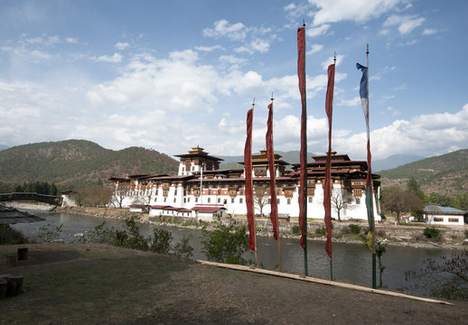 Prayer flags by Punakha dzong (monastery), at the confluence of the Pho chu (Father) and Mo Chu (Mother) rivers, Punakha, Bhutan