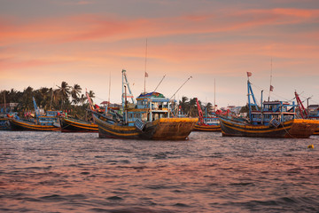 Fototapeta premium Fishing ships at sunset