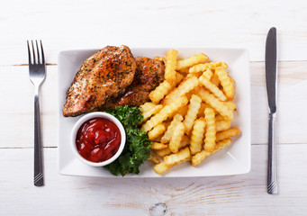  Fried chicken on a plate with french fries