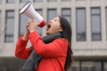 Modern young Chinese woman protesting