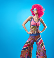 Fashion Model woman, Stylish hairstyle. Fashion Makeup. Cheeky Sexy Model girl, Stylish summer Hipster Outfit. Fashion pose. Trendy Glamour Sunglasses. Playful Afro hairstyle. Party Disco Creative