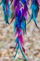 Dreamcatcher made of feathers, leather, beads, and ropes