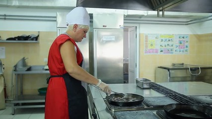 The process of cooking in the dining room.