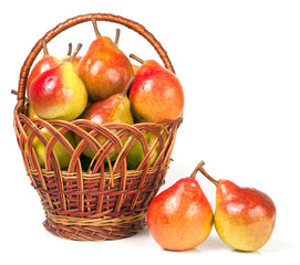 pears in a wicker basket isolated on white background