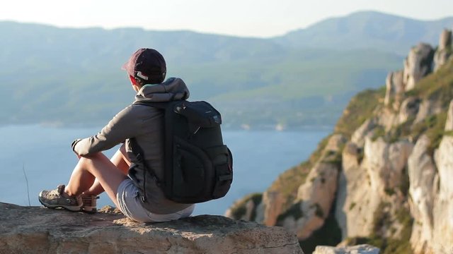 Young female tourist enjoying beautiful view in the mountains, Calanques, France