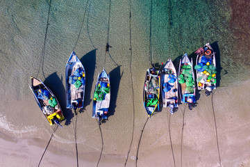 Old fishing boats on a tropical beach - Aerial photo