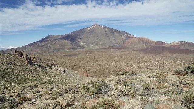 Footage of dramatic volcanic landscape with majetic Teide volcano in a background, Tenerife, Canary Islands, Spain.
