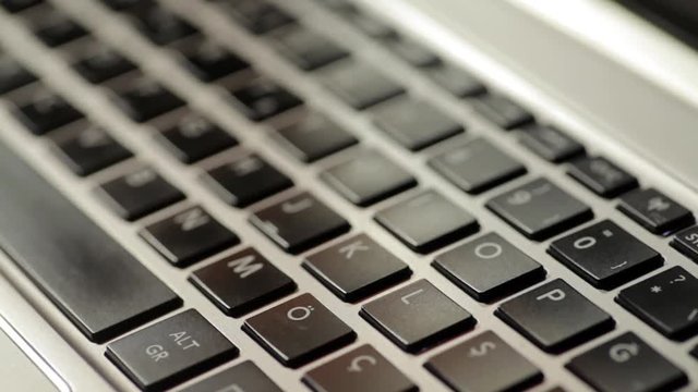 Close up footage of a laptop keyboard, with shifting focus.