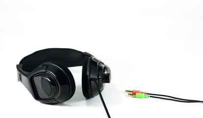 Headphone and jack plug on white bakcground.