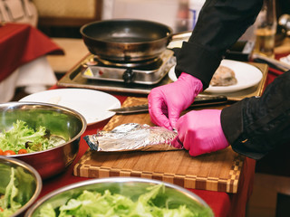 the process of making salad; salad of greens and duck meat,meat