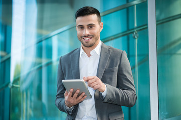 Businessman using his digital tablet