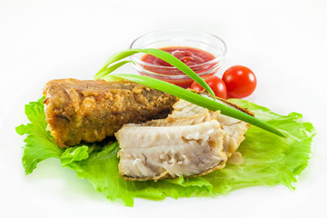 fried hake with tomatoes and green onion