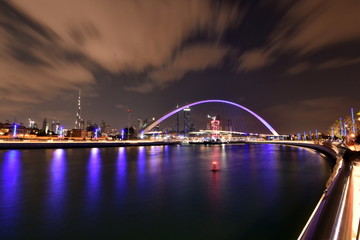 Dubai Skyline at night from new Dubai Canal, U.A.E