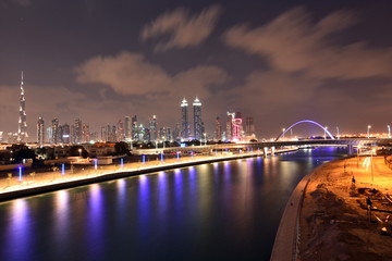 Fototapeta na wymiar Dubai Skyline at night from new Dubai Canal, U.A.E
