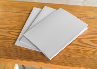 Blank catalog, magazines,book mock up on wood background .
