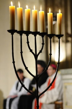 Menora in Catholic church lit during an Ecumenical celebration, Paris, France