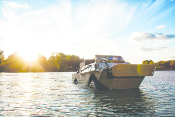 BRDM, armoured reconnaissance and patrol vehicle in the river,military machine
