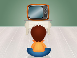 child in front the television