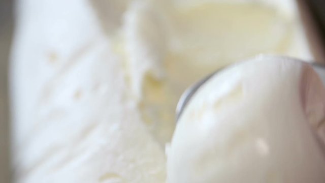 scooping vanilla ice cream ball