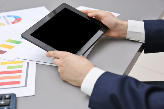 Businessman with tablet in office