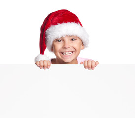 Boy in Santa hat with blank