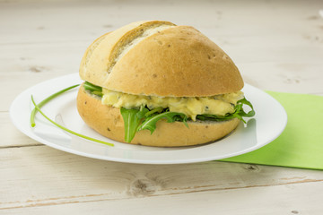 White sandwich with egg and chive salad