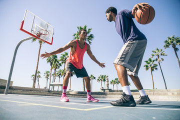 Fototapeta premium Friends playing basketball