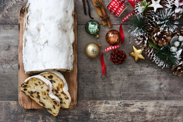 Christmas stollen. Traditional German Christmas dessert on wooden background
