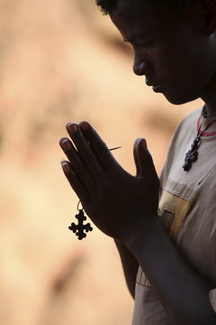 Young man praying in Lalibela, Ethiopia