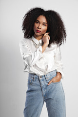 black woman with curly hair in studio shoot