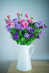 Beautiful flower bouquet on wooden table
