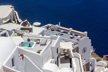 Beautiful view of typical Greek white architecture of Santorini Iceland with swimming pool, Greece