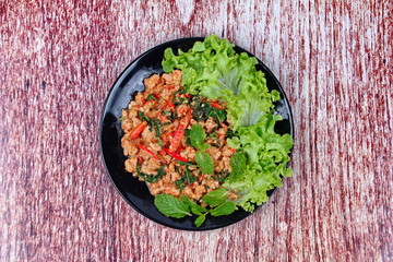 Fried spicy basil with minced pork topped lettuce.
