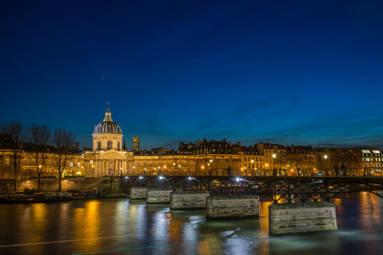Fototapeta Pont des arts Bridge by the Seine river in Paris at night