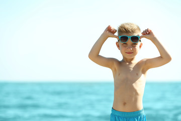 Cute boy having fun on beach