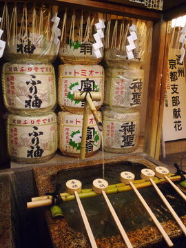 Ablution ladles at the entrance of a Shinto shrine, Kyoto, Japan