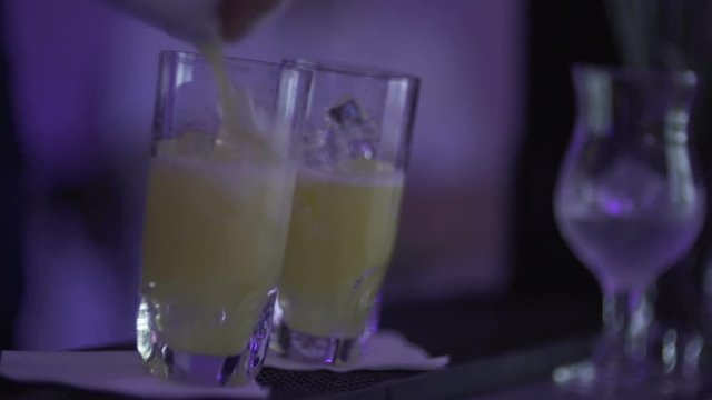 SLO MO CLOSE-UP Bartender preparing cocktail