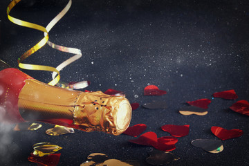 Abstract image of champagne bottle and festive lights