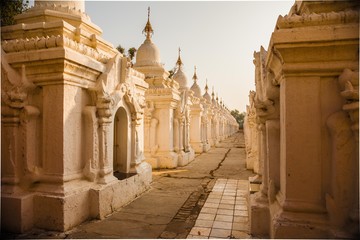 Shrines of the "World's Largest Book" at Kuthodaw Pagoda at sunrise in Mandalay, Myanmar