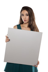 advertising young woman in a short turquoise dress holding empty banner